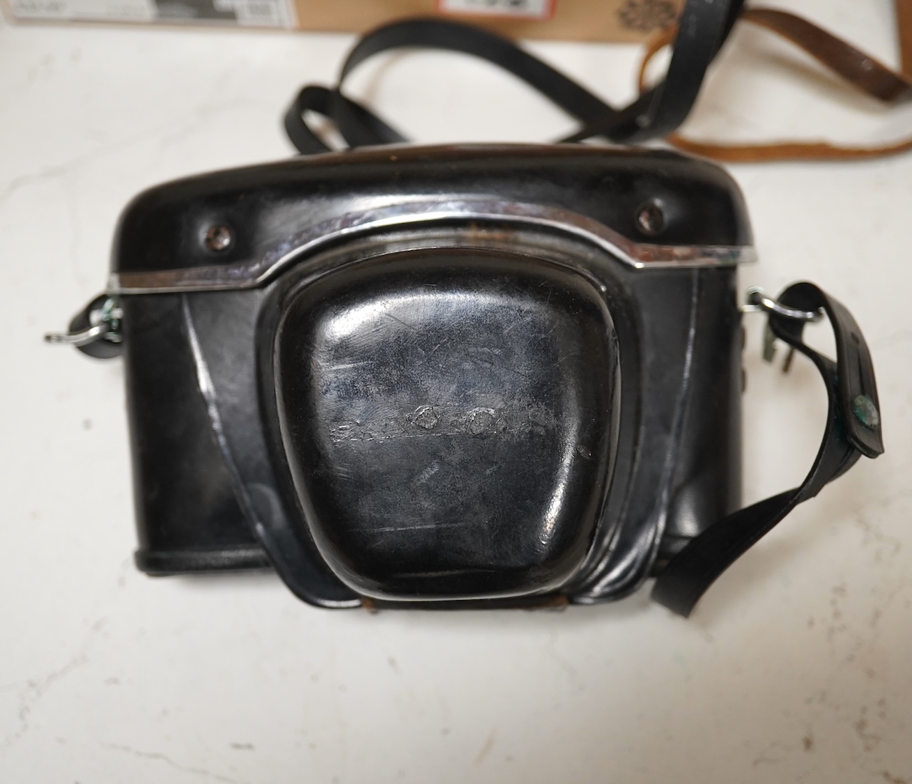 A pair of Taiga binoculars, various cameras etc. Condition - appears fair